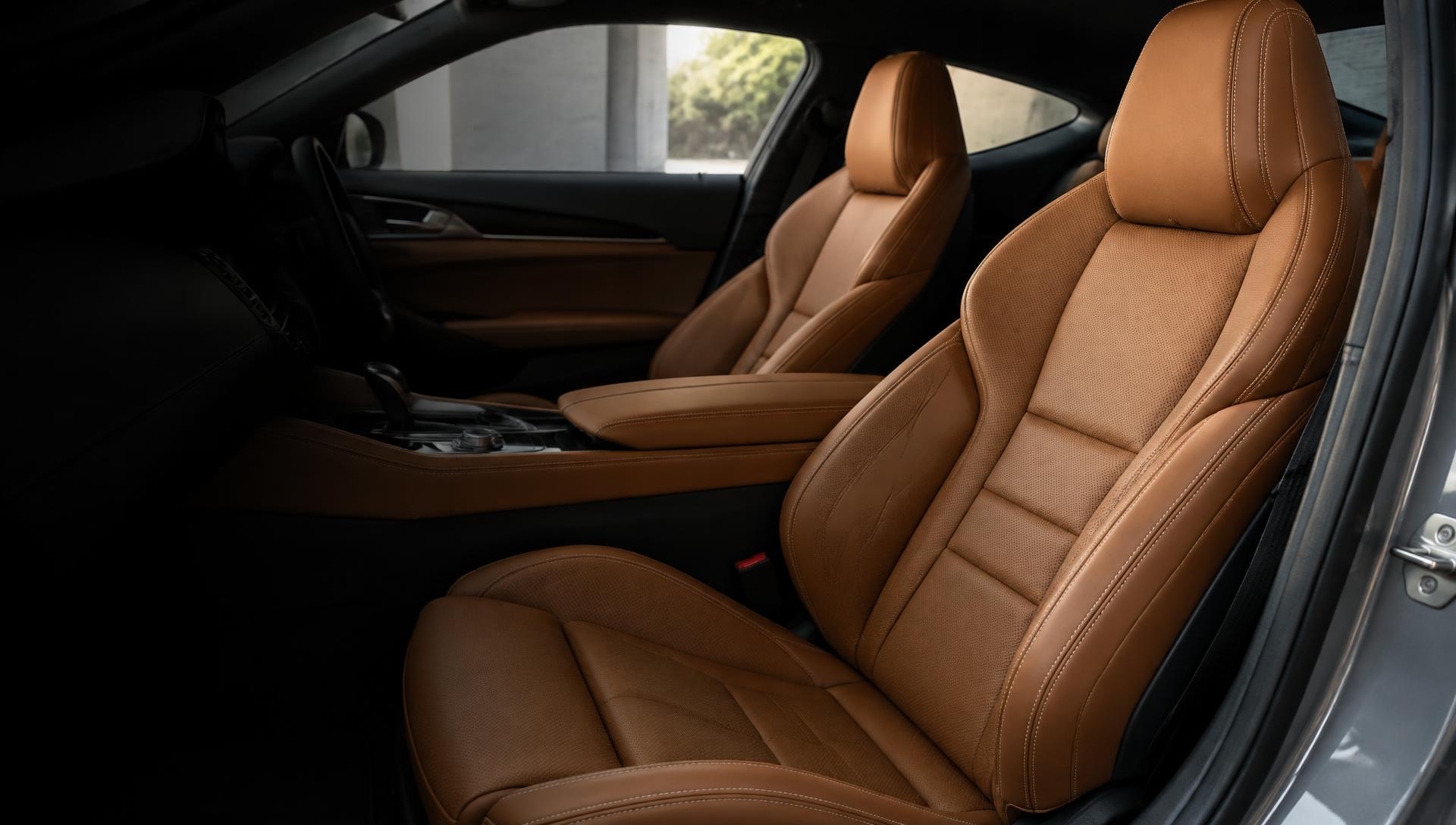 Rich cognac leather seats with precision stitching in a luxury car interior